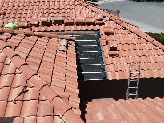 Tile repair. New battens and underlayment. Existing tile reset