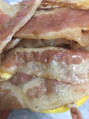 Raw, fatty bacon on sandwich. Yuck!