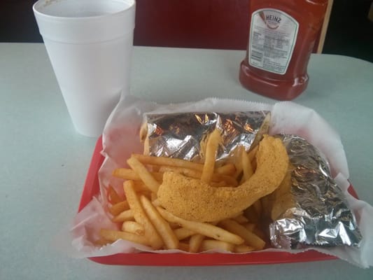 Fried fish po boy and drink.