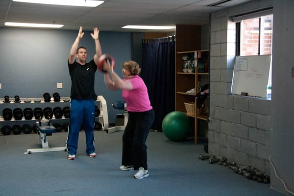 Medicine Ball Squat and Toss works a ton of muscles