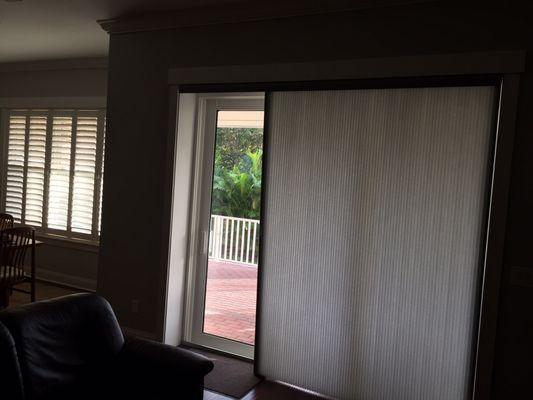 Blind partially closed for large sliding glass door.