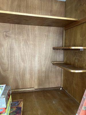 Book shelves sanding and primer two times caulking and paint two times white and remove small pieces of wood and attach two longer boards.