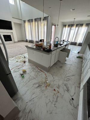 Kitchen was trashed and food jars busted on the floor, ketchup, mustard and other ingredients.