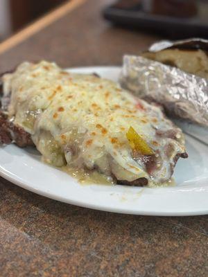 Dry Creek Strip - smothered in Hatch Green Chile Sauce finished with Asadero Cheese