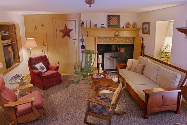 Enjoy a cozy visit with guests in the 1735 summer kitchen complete with original hearth/fireplace