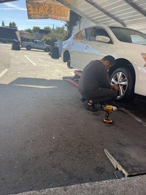 Putting new tires on my girls car.