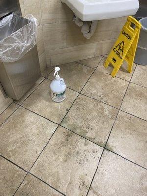 Soap on the floor in a jug. Soap covering the floors be careful not to slip