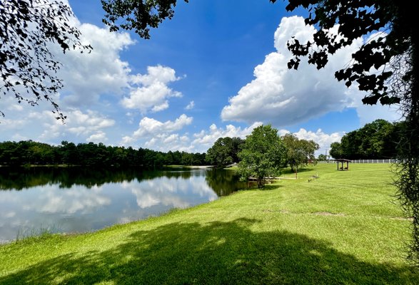 clear lakes show the reflection of the nearby tree line