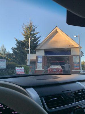 They scrub your car down before entering the car wash