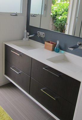 Custom sinks and cabinet wrap in Corian