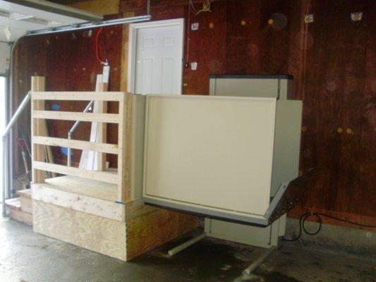 Platform Lift installed in the garage for quick and easy access inside your home