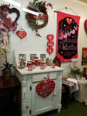 Valentine's Day decorations in the display window.