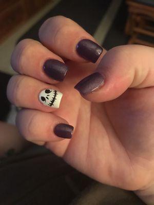 Jack skellington & dark purple acrylic nails.