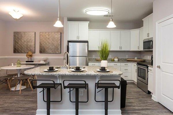 Reserve at Stone Port apartment offer breakfast bars and separate dining spaces.