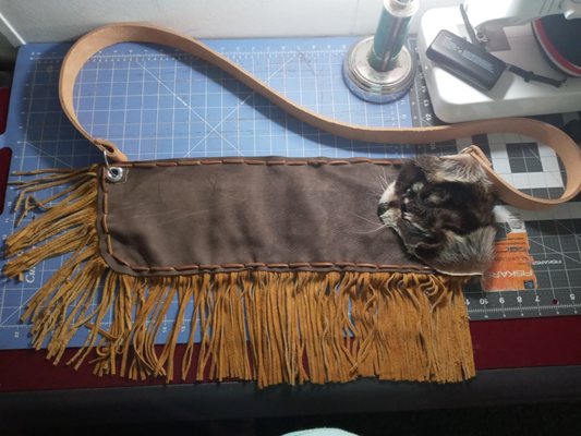 Rifle sling with raccoon head