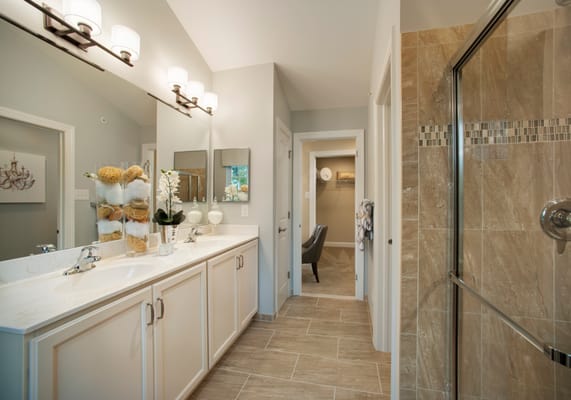 At Saddlebrook Estates visit our decorated model  homes to see this luxurious Master Bathroom with double bowl vanity, over-s...