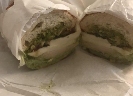 Chicken pesto sandwich on Dutch crunch with everything