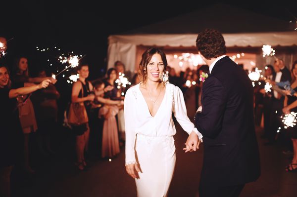 Joyous sparkler send-off at evening wedding at Moss Mountain Farm