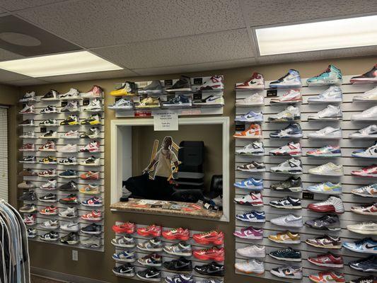 GS Wall. Shoes above and below counter are various mens sizes.