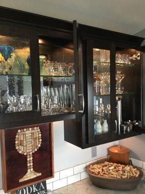 Bar area with "seady" glass, and mirrors behind.