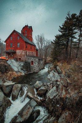 An epic shot of the Old Red Mill on a moody snowy day