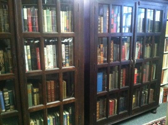 Fancy books in glass cases.