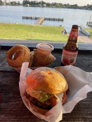 A cheeseburger  with onion rings