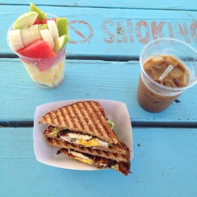 Breakfast sammy, fruit salad, iced coffee