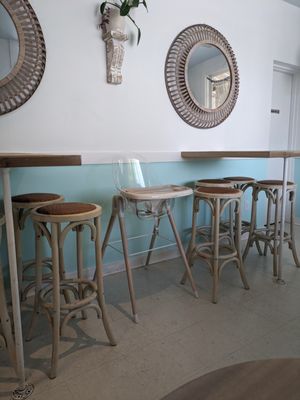 High tables with stools.
 Store supplied highchair.