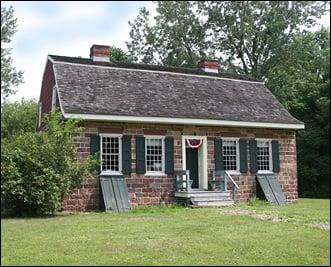 Sandstone center-hall 4 room house, full cellar & garret/attic, gambrel roof. Moved from New Milford to River Edge in 1977.