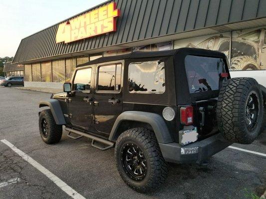 New soft top, wheel, tires, and step rails.