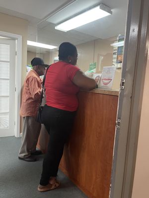 Patients at the reception desk