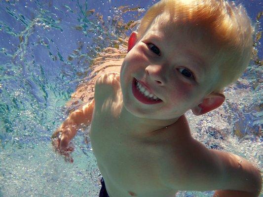 Happy swim lessons for children in Carlsbad.