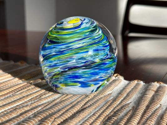 Hubbies paperweight - can't tell but there is an inside with all the cool and swirls and then a clear outside