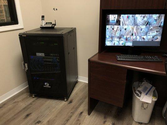 Camera system and secure managed firewall in an equipment rack.