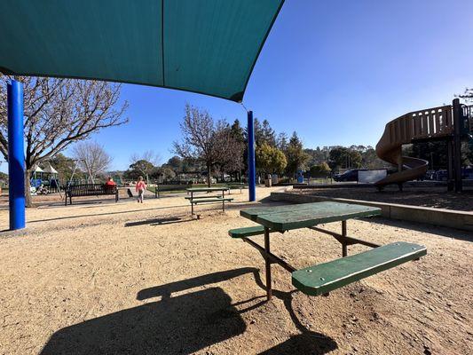 tiny picnic tables under partial shade