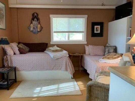 Twin beds and view of the desert and mountains to the west.