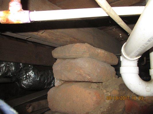 Rock pier underneath a 1920's home. This is not a defect but is something I think my clients would like to know about.