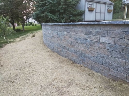 Retaining Wall- 120'L  installed to level off driveway above it.  Hardscape & landscape contractor.