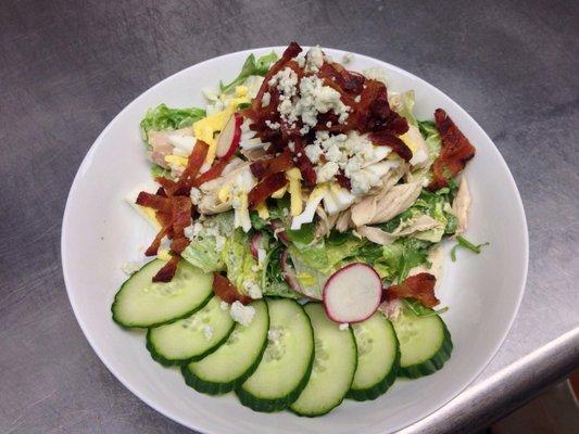 Cobb salad: English cucumber, radish, Pt. Reyes blue, roasted free range chicken, applewood smoked bacon, green goddess dressing