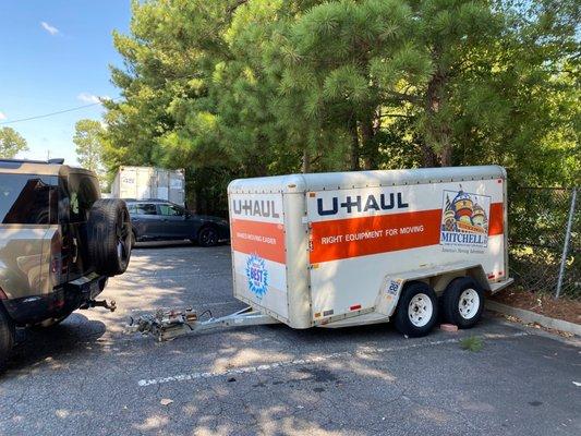 Trailer being dropped off. Note: U-haul trailers do not have a tongue jack and they are very heavy, and no worker in the lot to help.