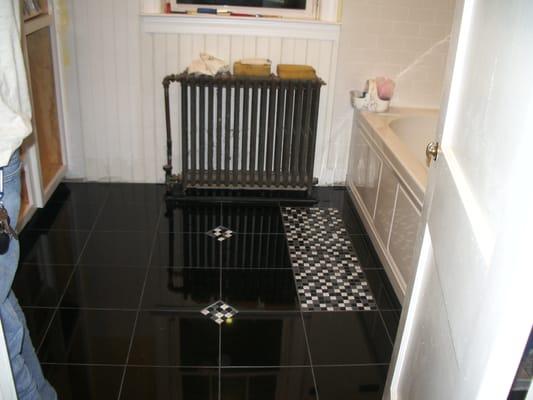 Bath Remodel in Catonsville, ,MD. Absolute Black granite tiles with glass mosaic tile inserts.