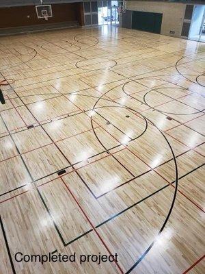 Refinished gymnasium hardwood floor & restripped game lines