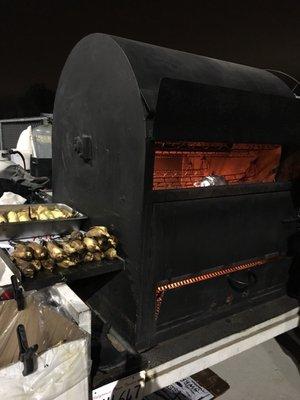 Margie's roaster. It's so cool to see the corn and potatoes get pulled out, hot and ready to serve.