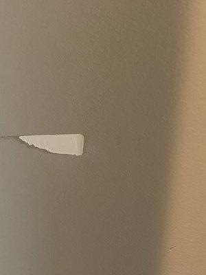 Gouge in bathroom wall