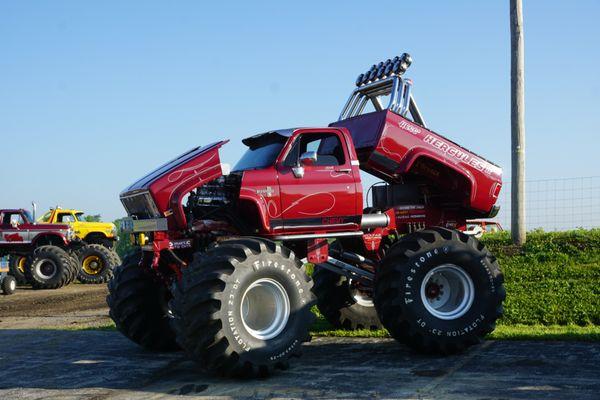 Hercules, Show Time and King Kong in the parking lot of the International Monster Truck Museum