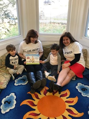 United Way Representatives Read to Neighborhood House Kids.