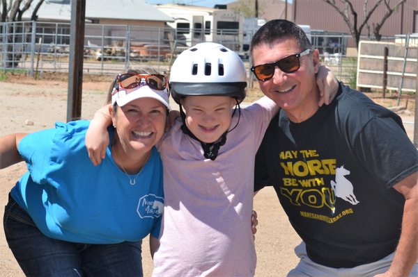 Child with Adaptive Riding Instructor and Volunteer