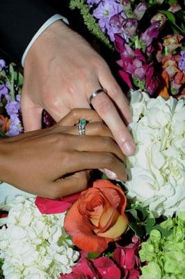 Hands with rings during wedding ceremony at Cal Tech, Pasadena.