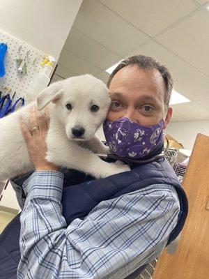 Owner and Vet, Dr. Baldridge with KayCee, a sweet Pyrenees puppy